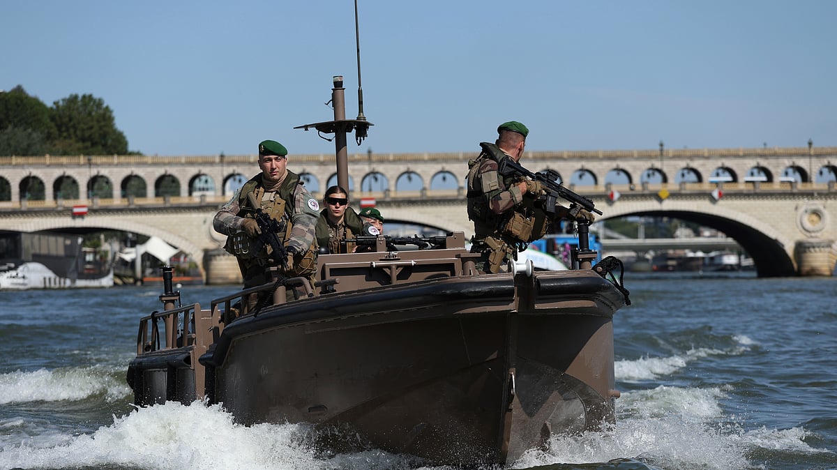 (AP Photo/Aurelien Morissard)
 : Soldiers patrol on the Seine river, Wednesday, July 17, 2024 in Paris. France's armed forces held a demonstration of the security measures planned on the River Seine, both in and out of the water, to make it safe for athletes and spectators during the opening ceremony of the Paris Olympics. Organizers have planned a parade of about 10,000 athletes through the heart of the French capital on boats on the Seine along a 6-kilometer (3.7-mile) route at sunset on July 26. 

